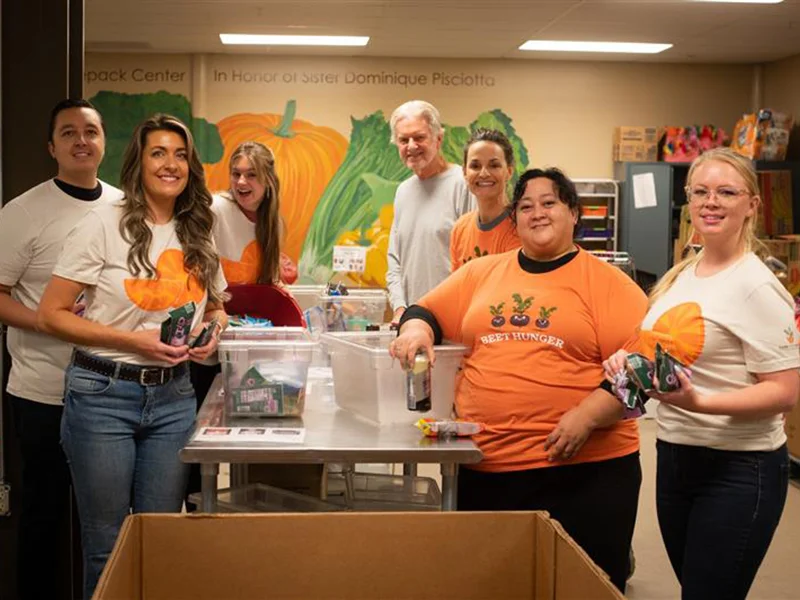 employees volunteering at Care and Share in Colorado Springs

