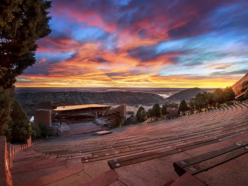 iconic red sandstone formations glowing at dawn with amphitheater seating visible