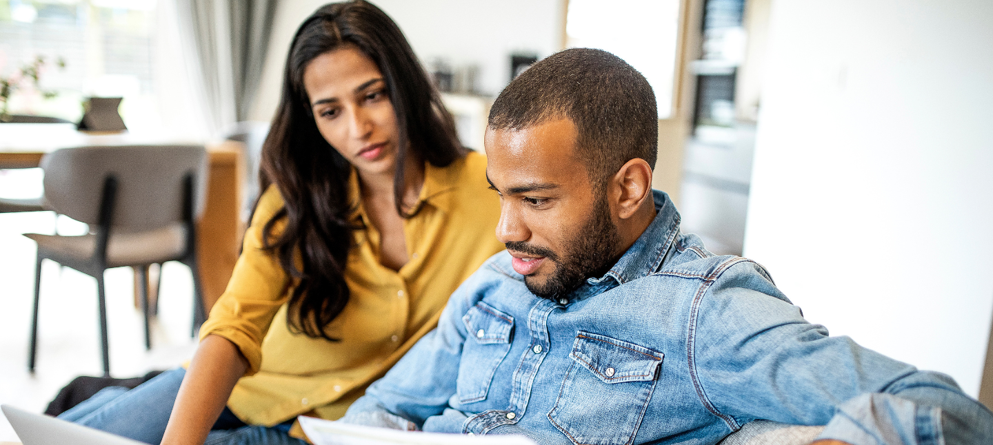 Young couple planning their finances together.
