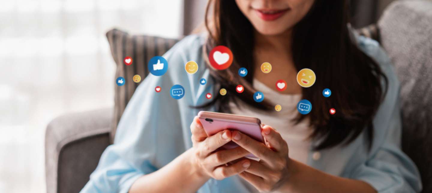 Young woman using mobile phone and relaxing at home, Modern lifestyle and social media concept