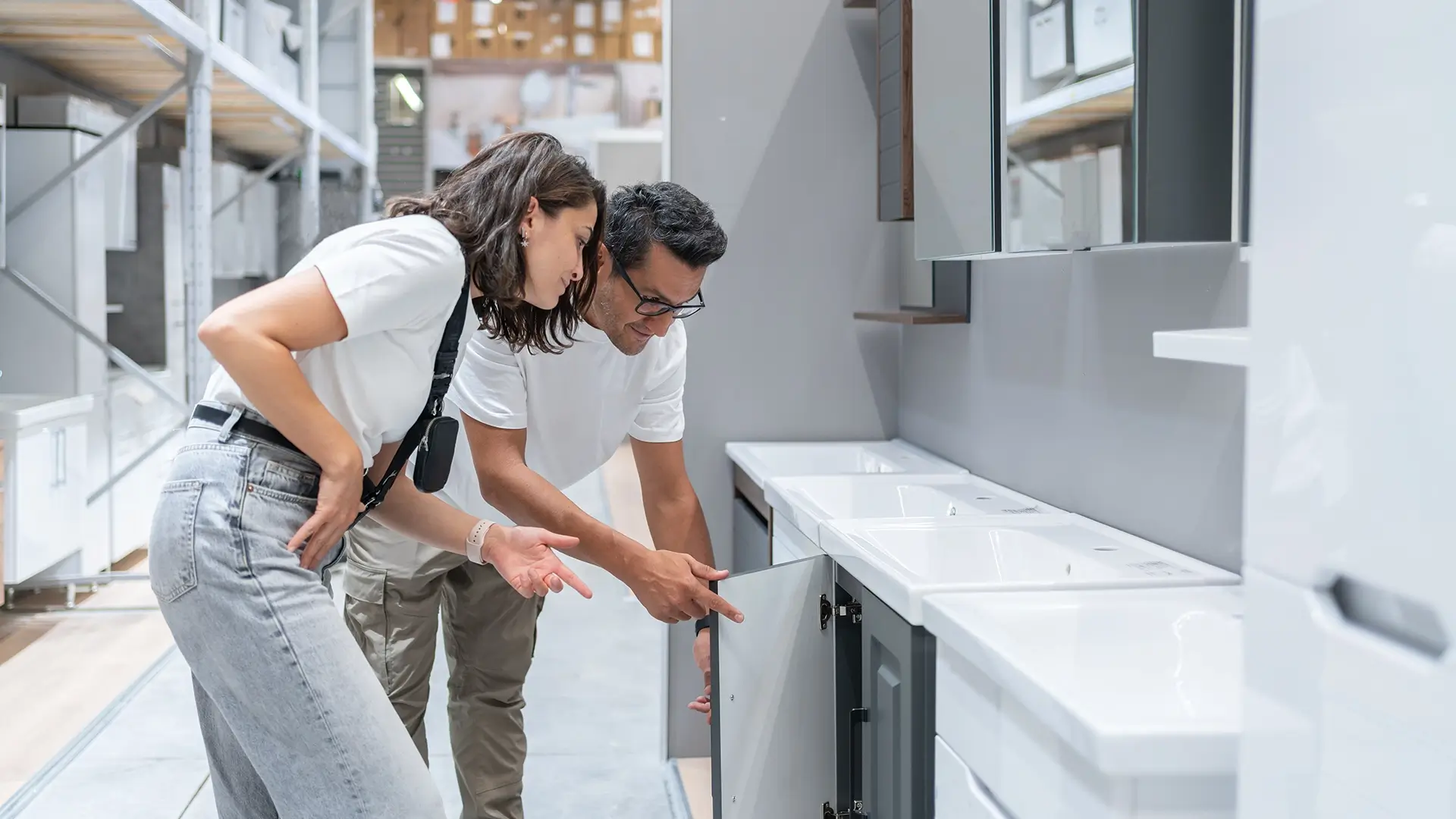 A newlywed couple shopping for a bathroom vanity