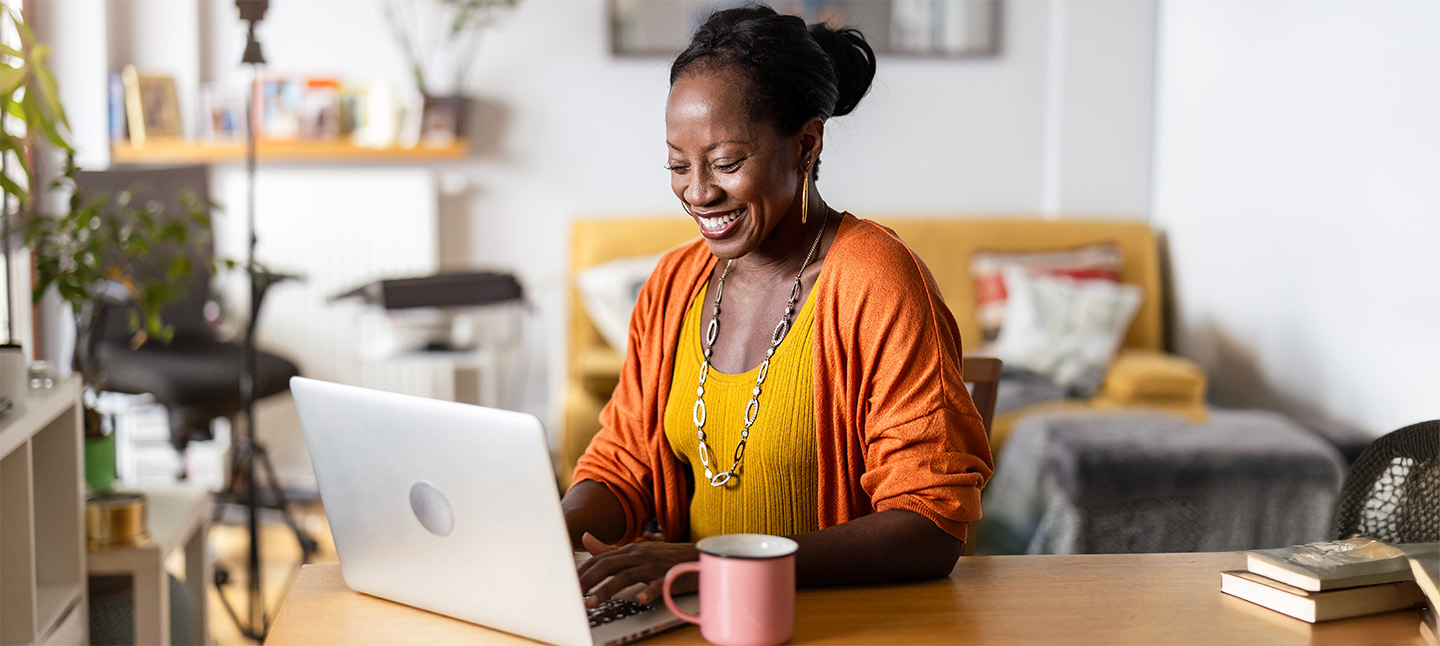 a woman working on laptop at home