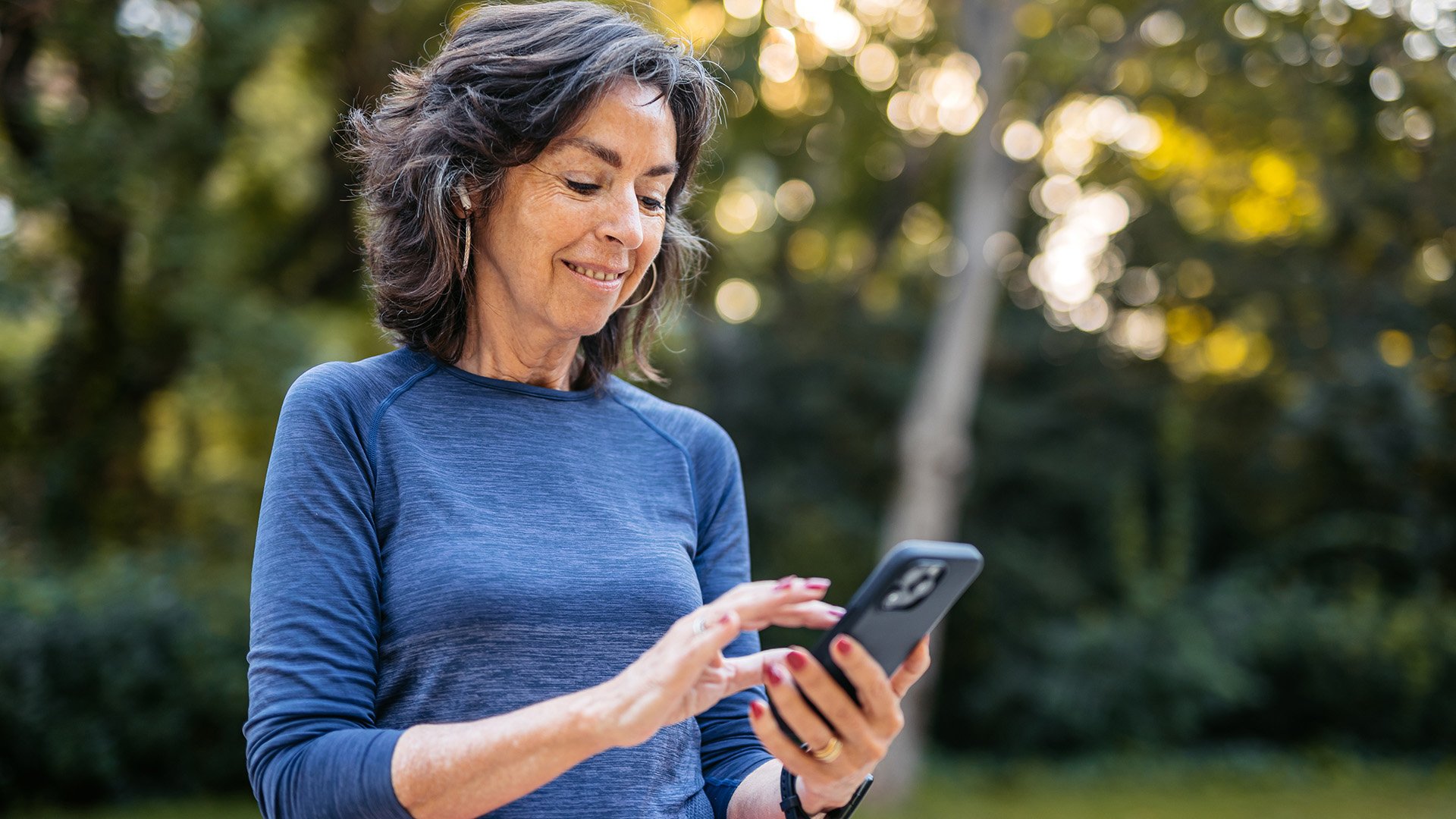 A woman outside on her cell phone