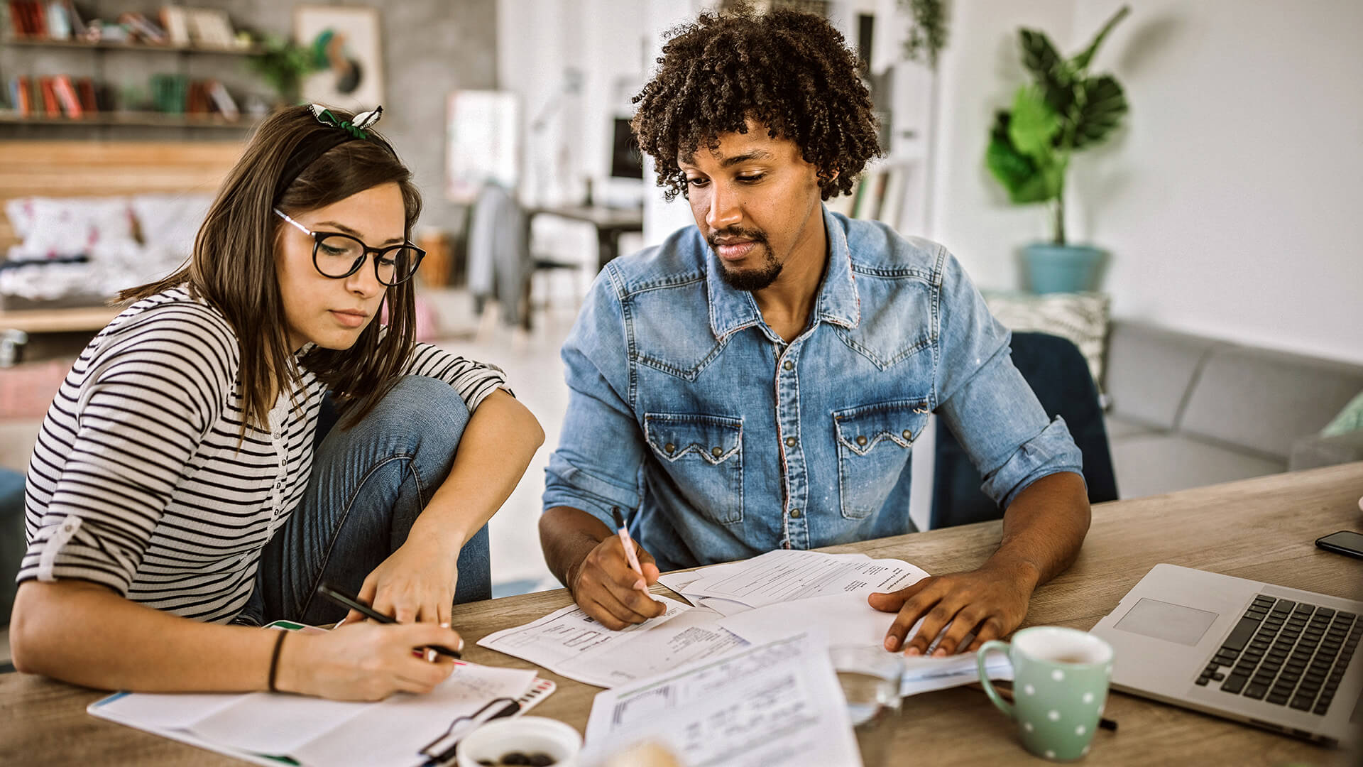 A couple planning their budget at home